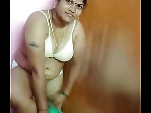 Indian aunty's unexpectedly erotic house move leads to a steamy clothes-shedding and sensual tease strip.