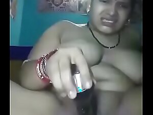 Indian wife stimulates herself to climax in erotic video